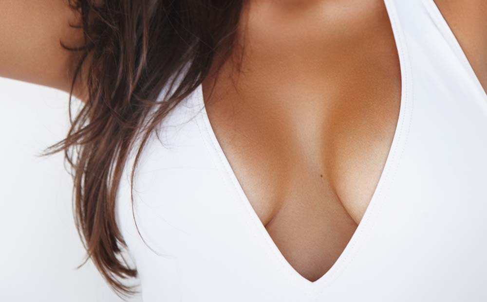 Woman in White shirt | breast Lift | Dr. Nikolov