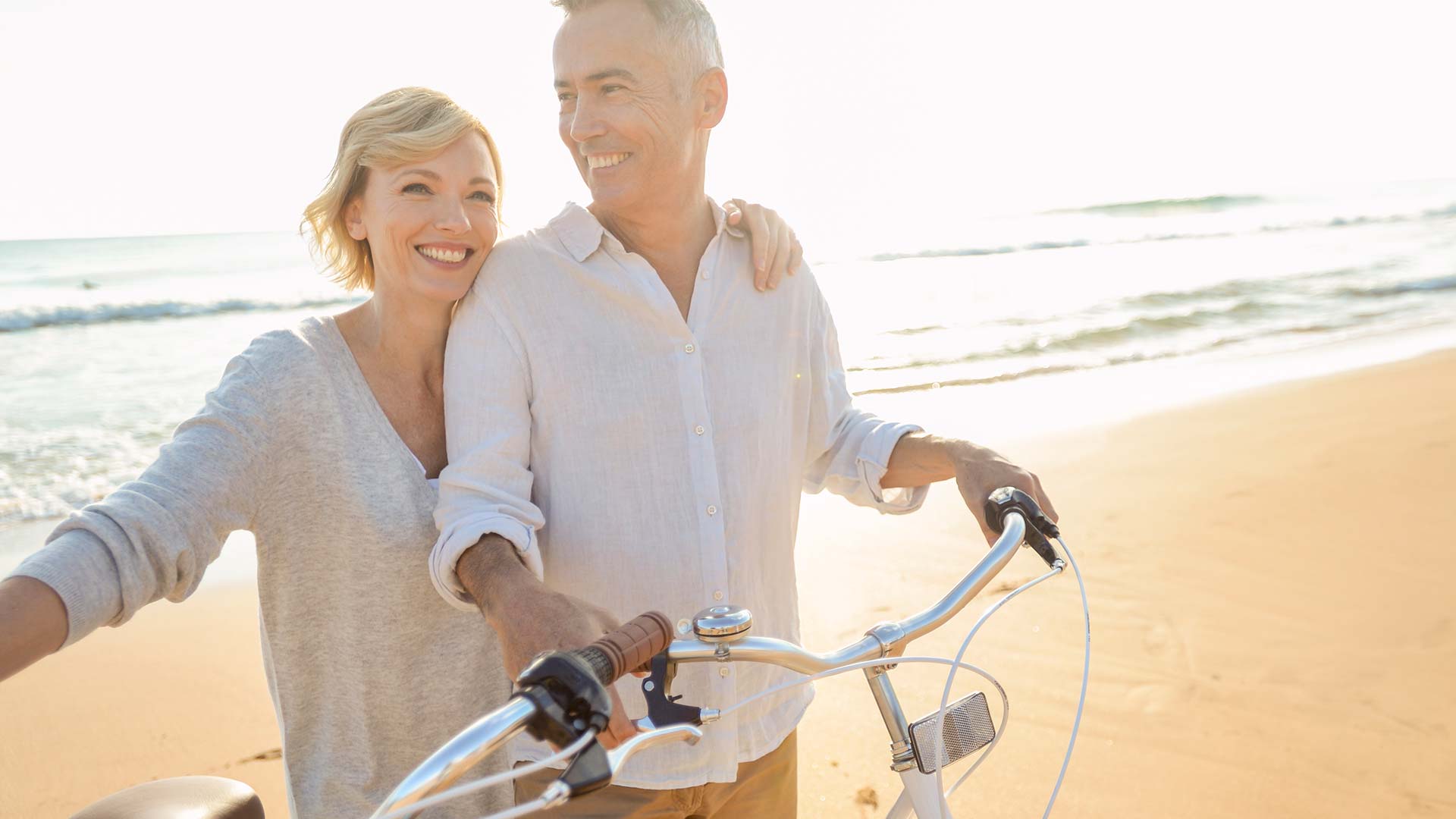 Couple on Sand | Male Breast Reduction | Dr. Nikolov